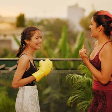 Indian Asian Hindu gen z young woman teach teen girl sport class learn hand fist punch air outdoor home healthy boxer adult female wear boxing gloves do effort beating self fight warm up workout house Indian Asian Hindu gen z young woman teach teen girl sport class learn hand fist punch air outdoor home healthy boxer adult female wear boxing gloves do effort beating self fight warm up workout house